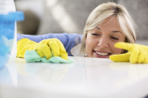 Team member preparing cleaning materials with safety awareness