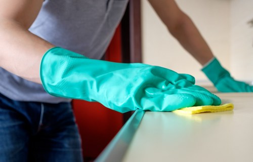 Clapham workplace cleaning team vacuuming a modern office